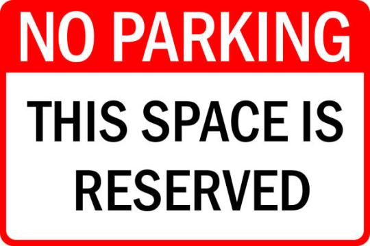 Sign no parking this space is reserved